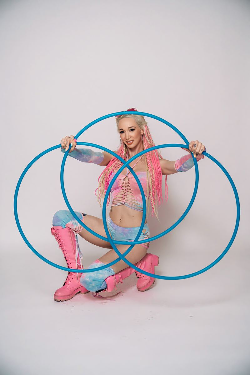 Ziggy kneeling with three blue hoops