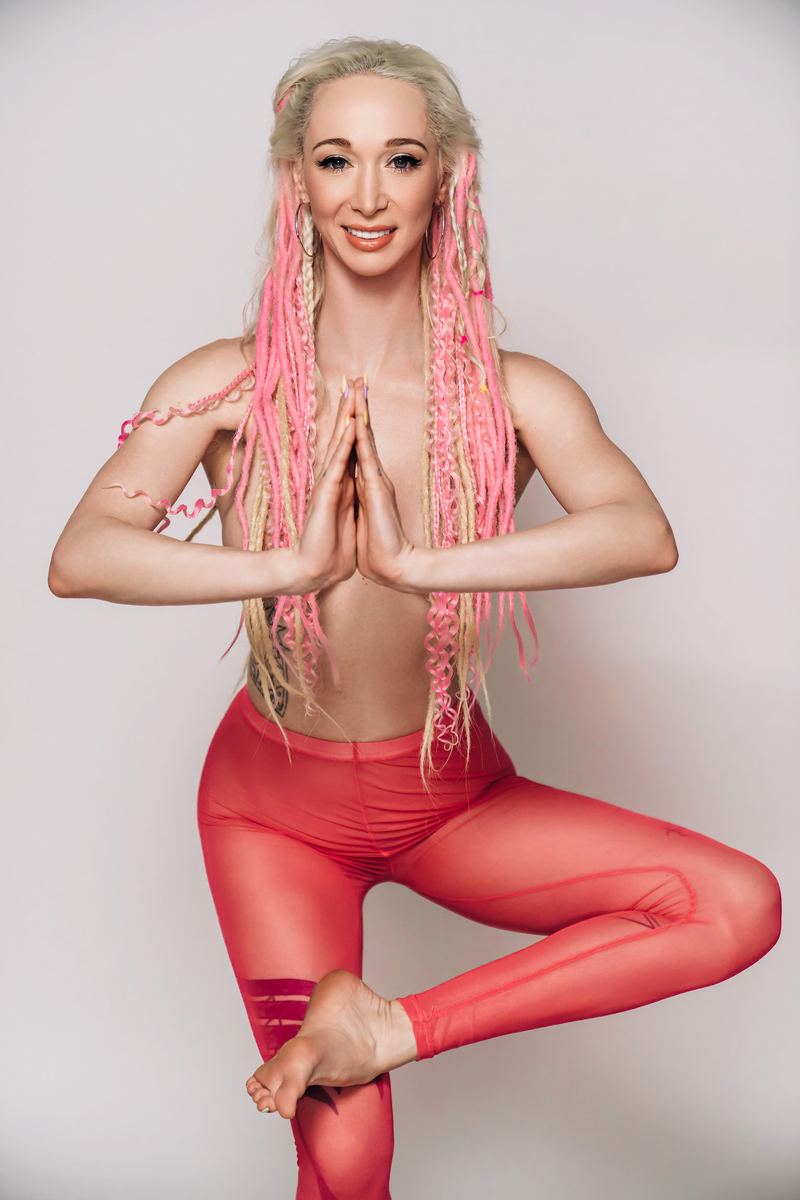 Ziggy Starlight in tree pose, prayer hands